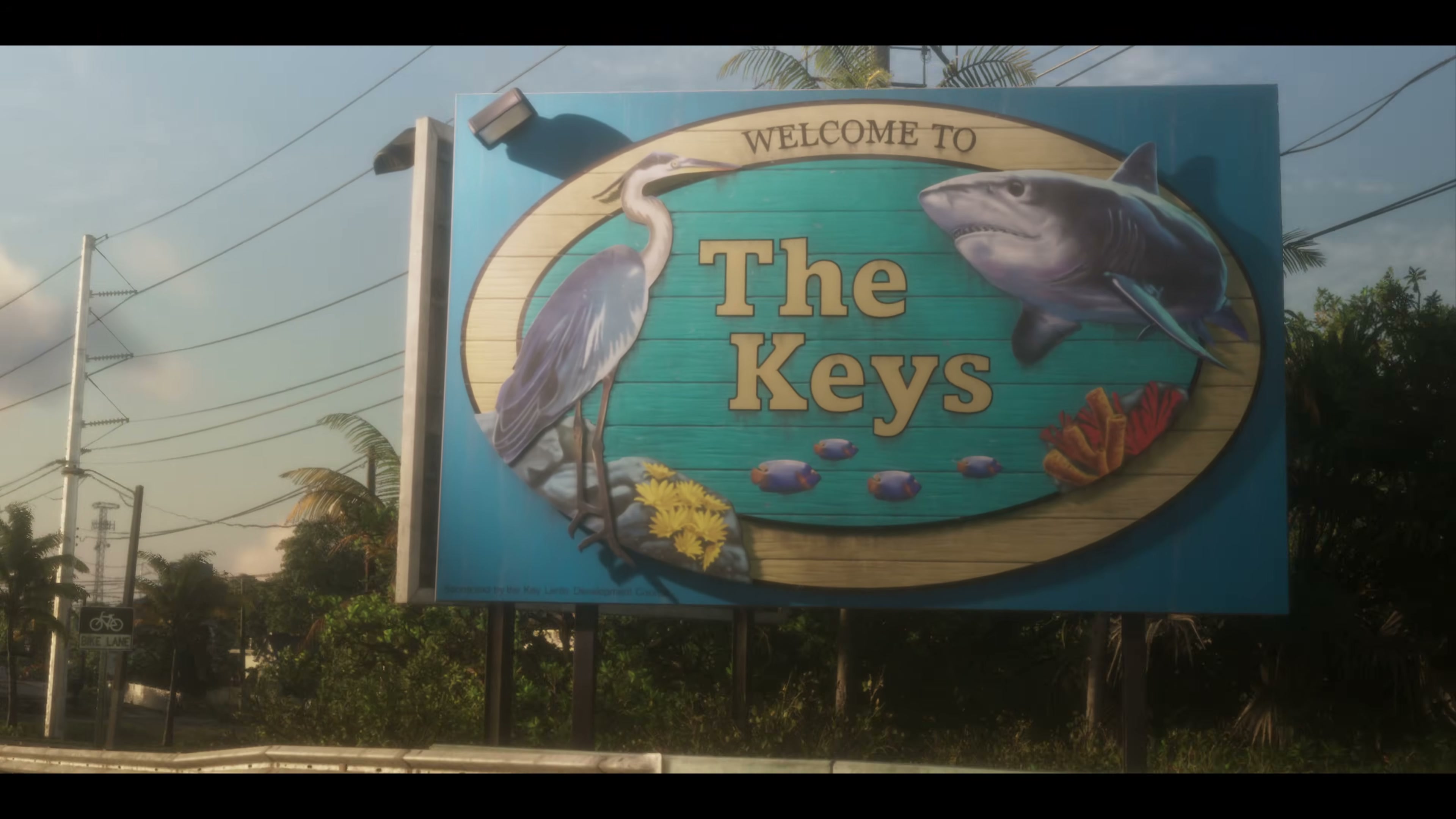 Welcome sign to The Keys with a heron and a shark