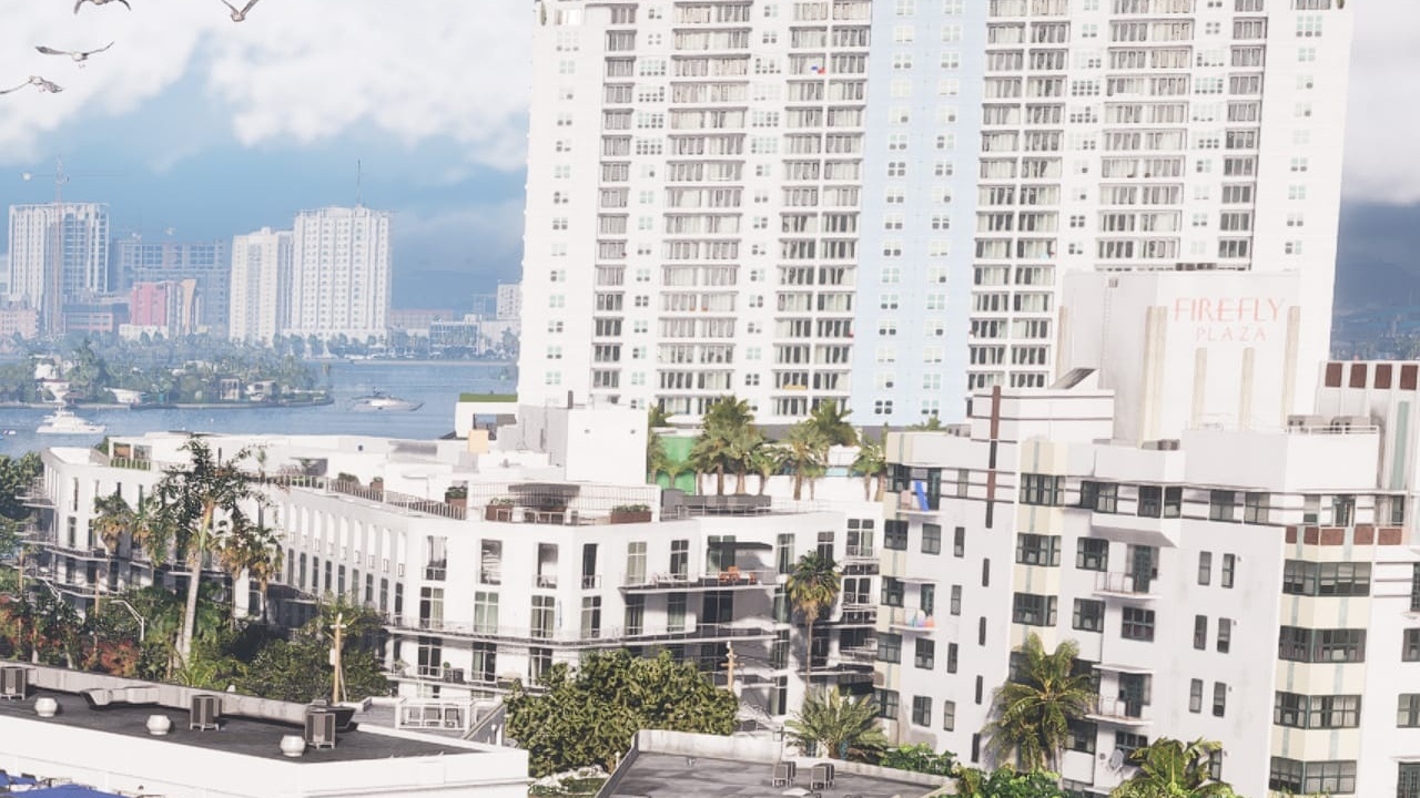 White apartment block with the Firefly Plaza sign on the roof