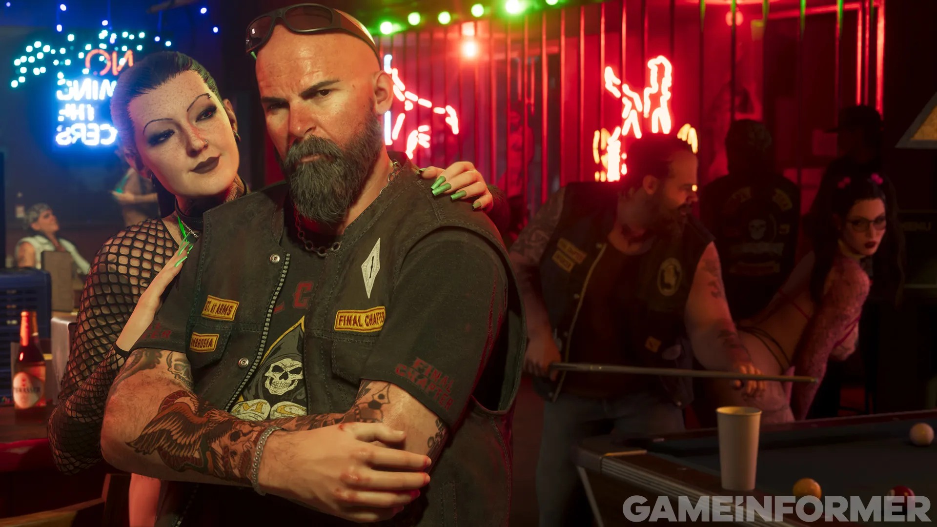 Bald biker in a Final Chapter vest embraced by a woman in a club with red neon signs and a pool table
