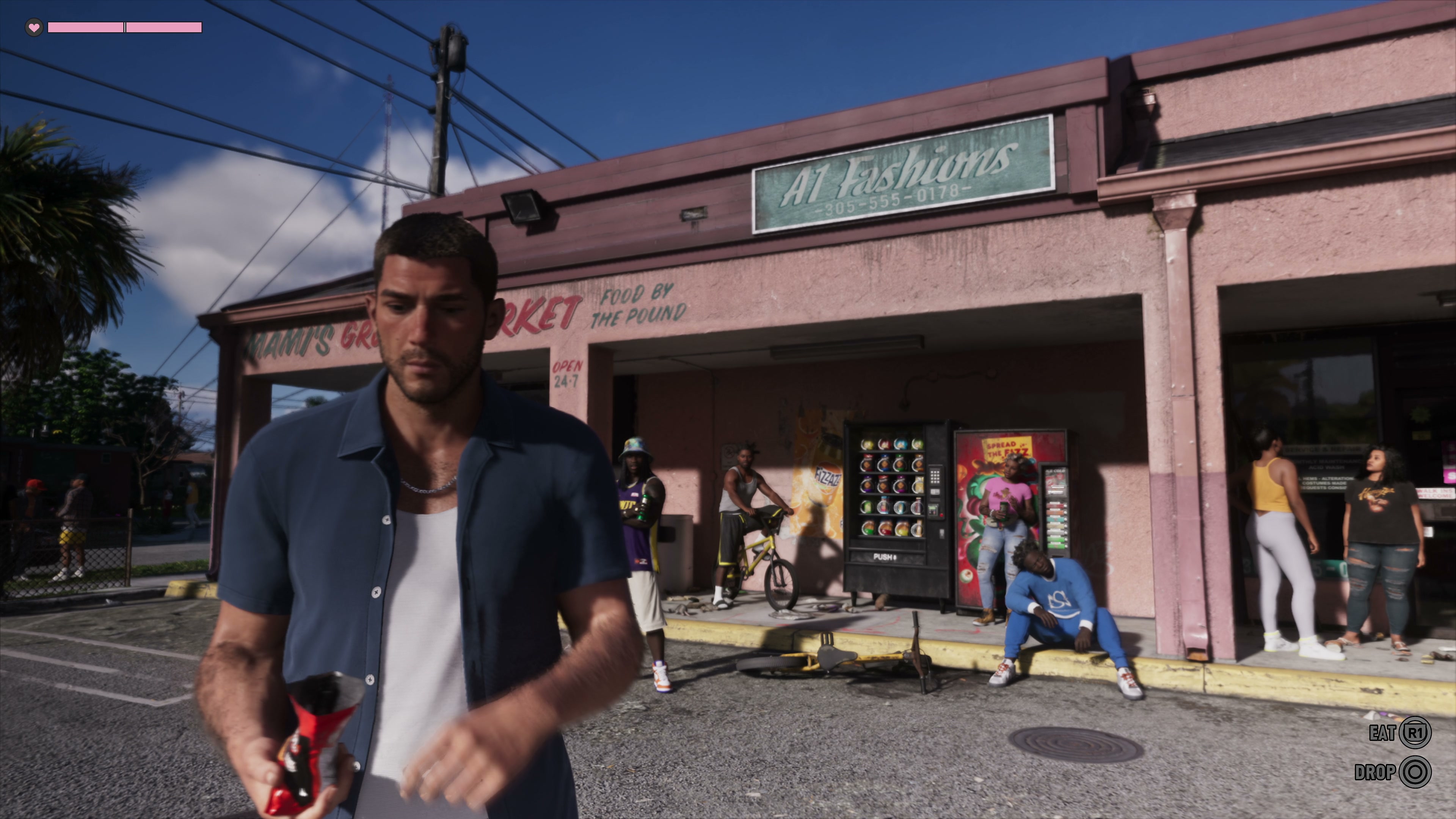 Jason walks out of Mami's Grocery Market, under the A1 Fashions sign
