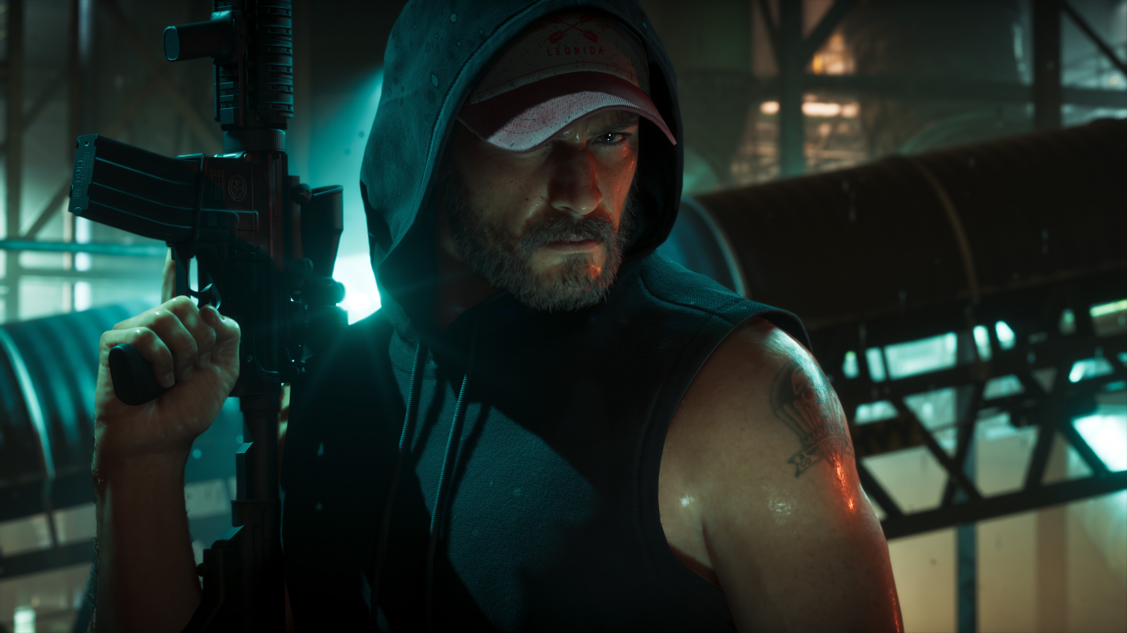 Man in a hoodie, Leonida cap and an arm tattoo holding a rifle; warehouse with green light.
