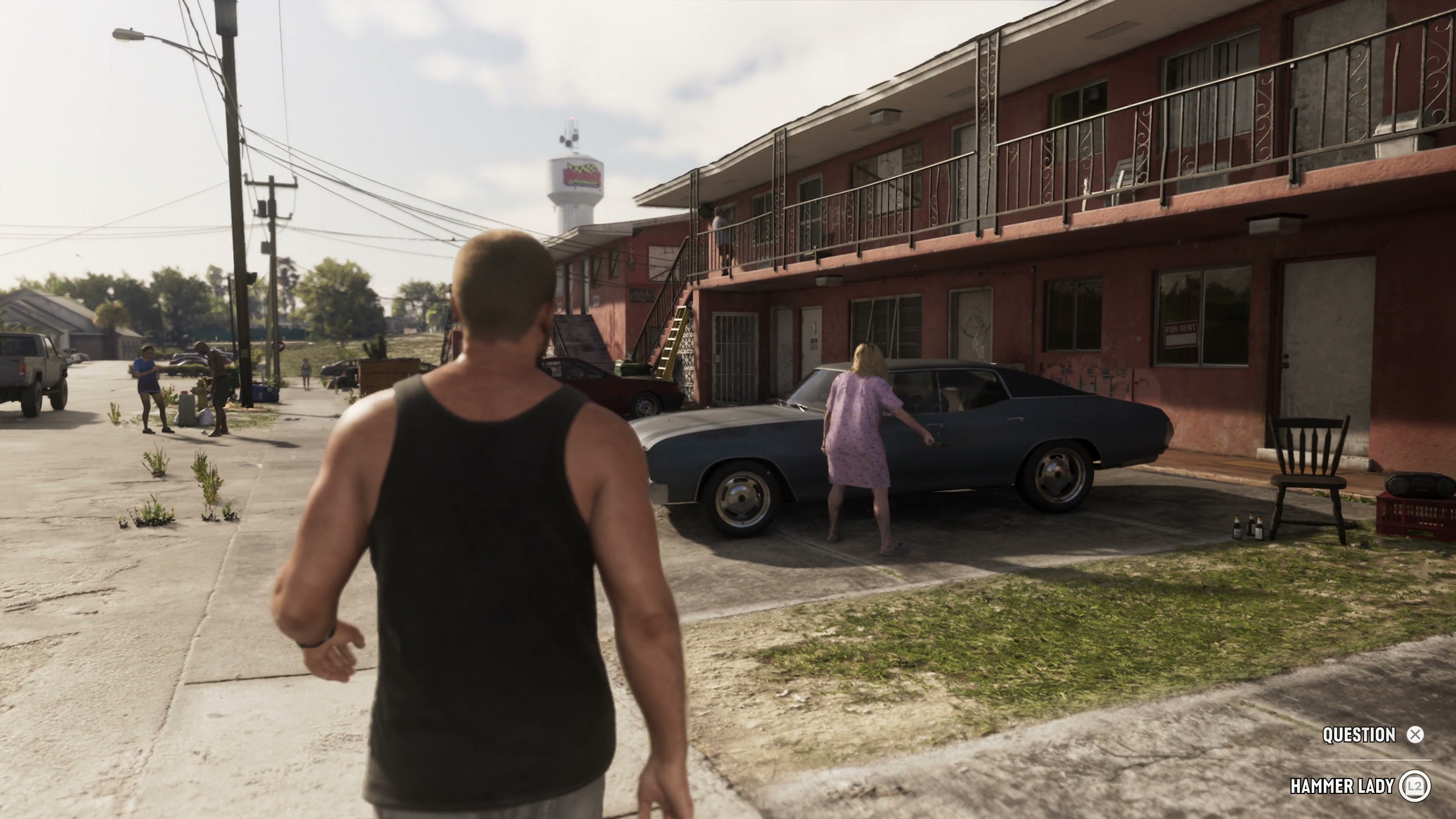 Jason walks outside a motel while a woman hits a car.