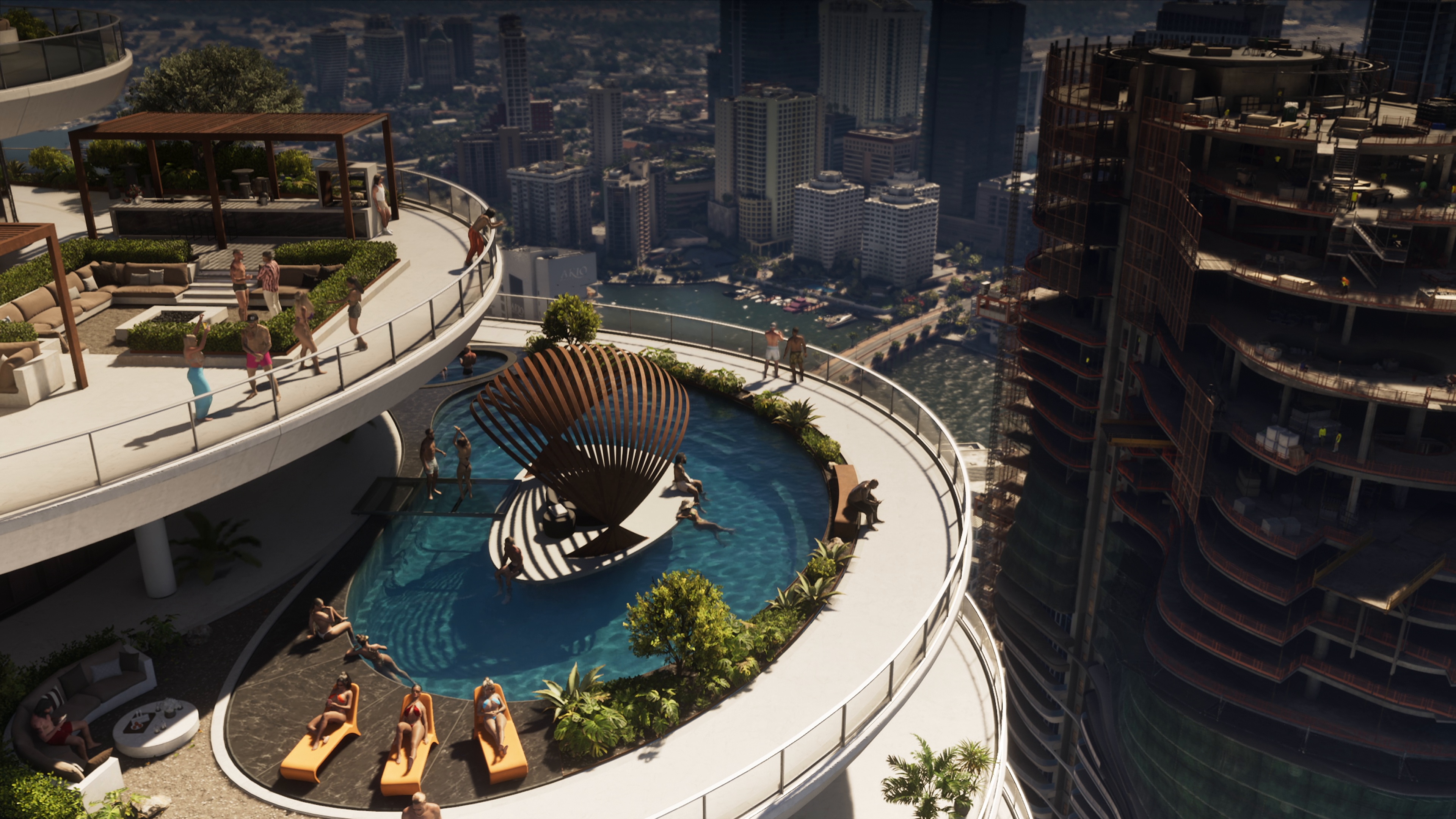 Curved rooftop pool on a Pegassi tower above the city and marina