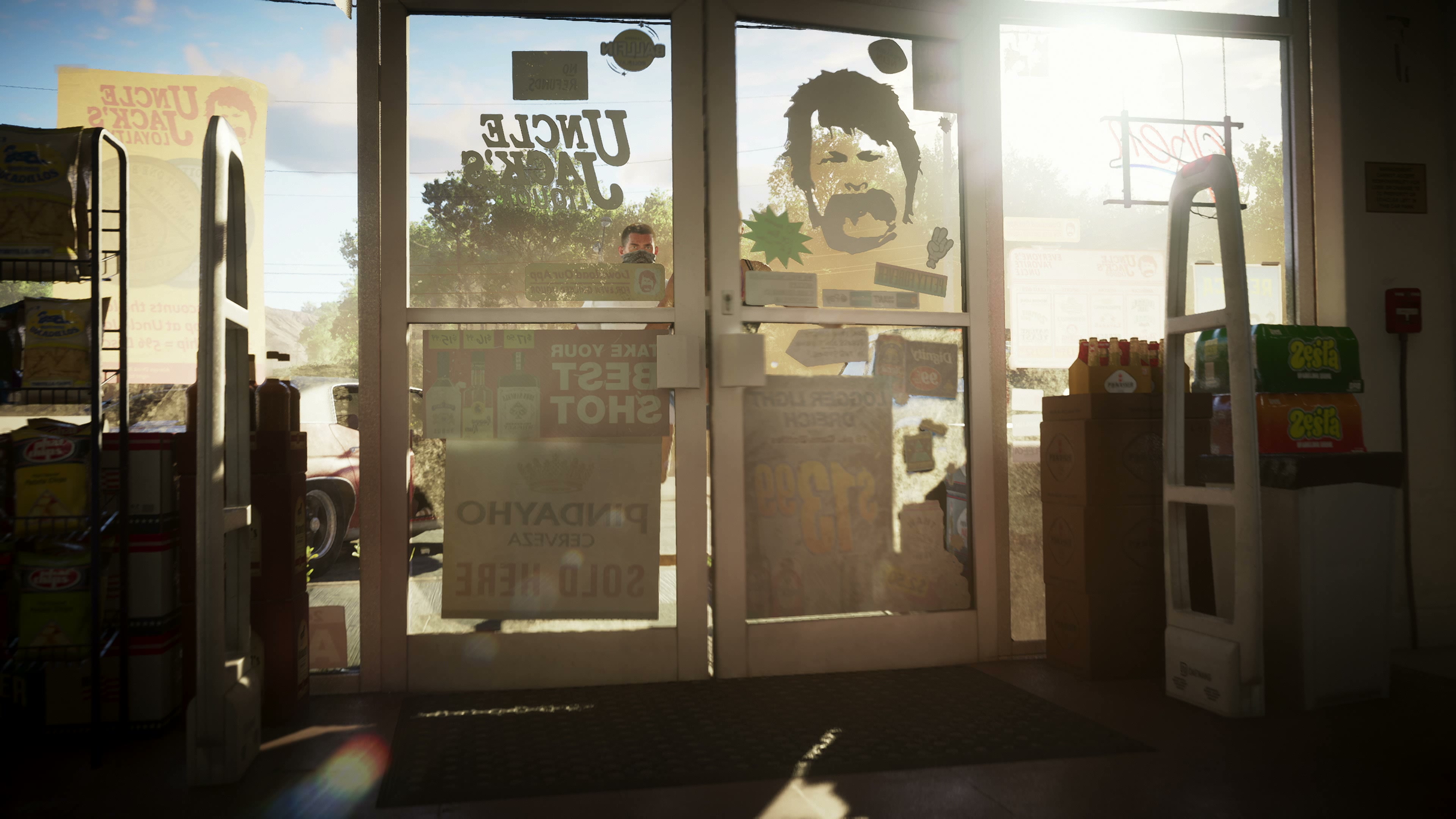 Backlit glass door of Uncle Jack's Liquor, with the name and Uncle Jack's face painted on it