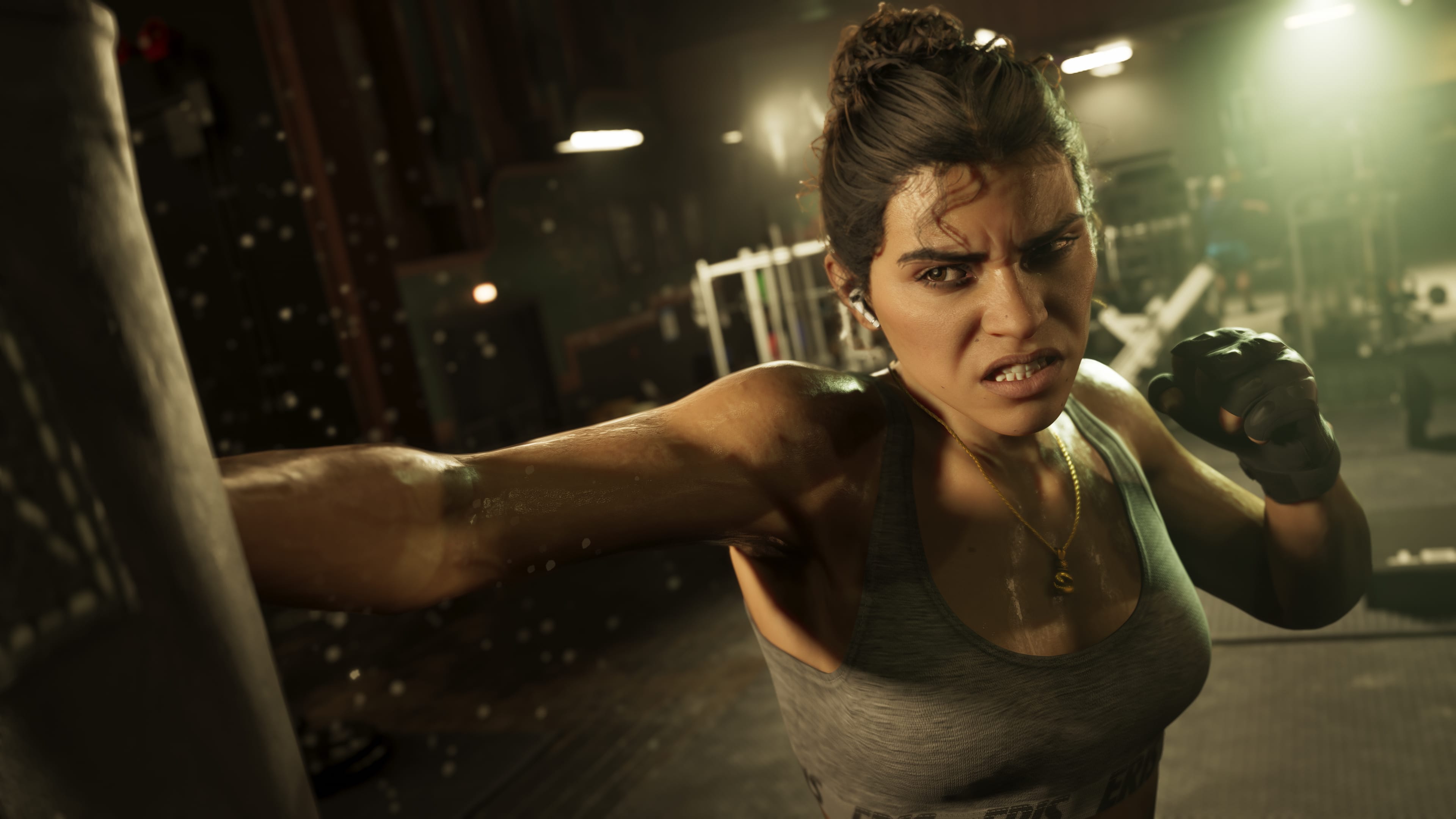 Lucia raising her fists in a fighting ring.