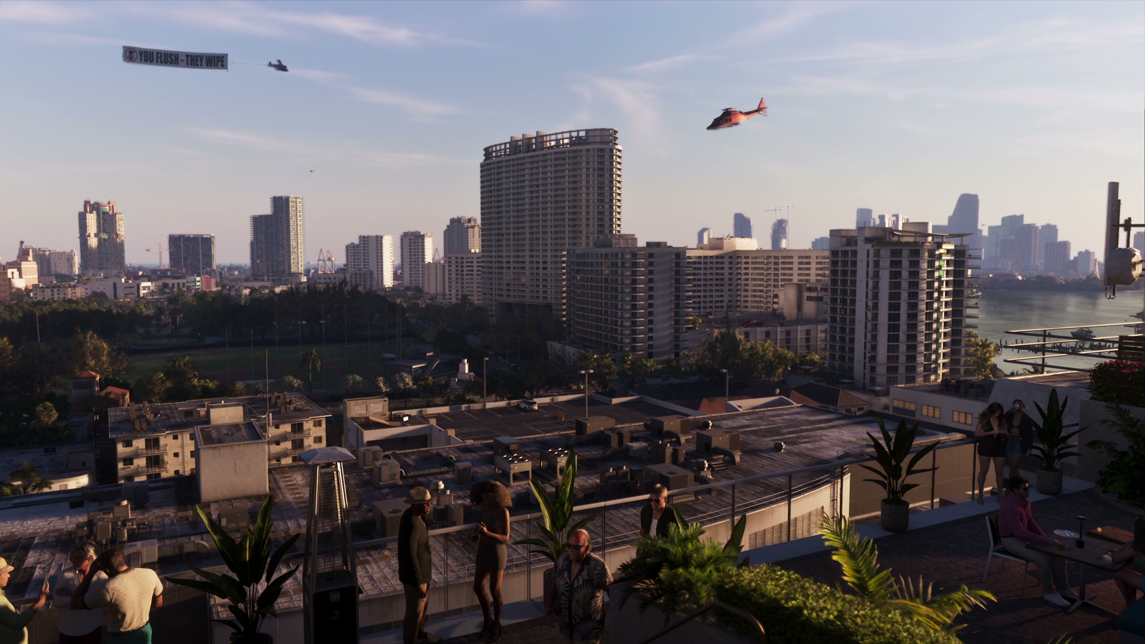 Rooftop view of the Ocean Beach hotels with the Vice City skyline behind at sunset