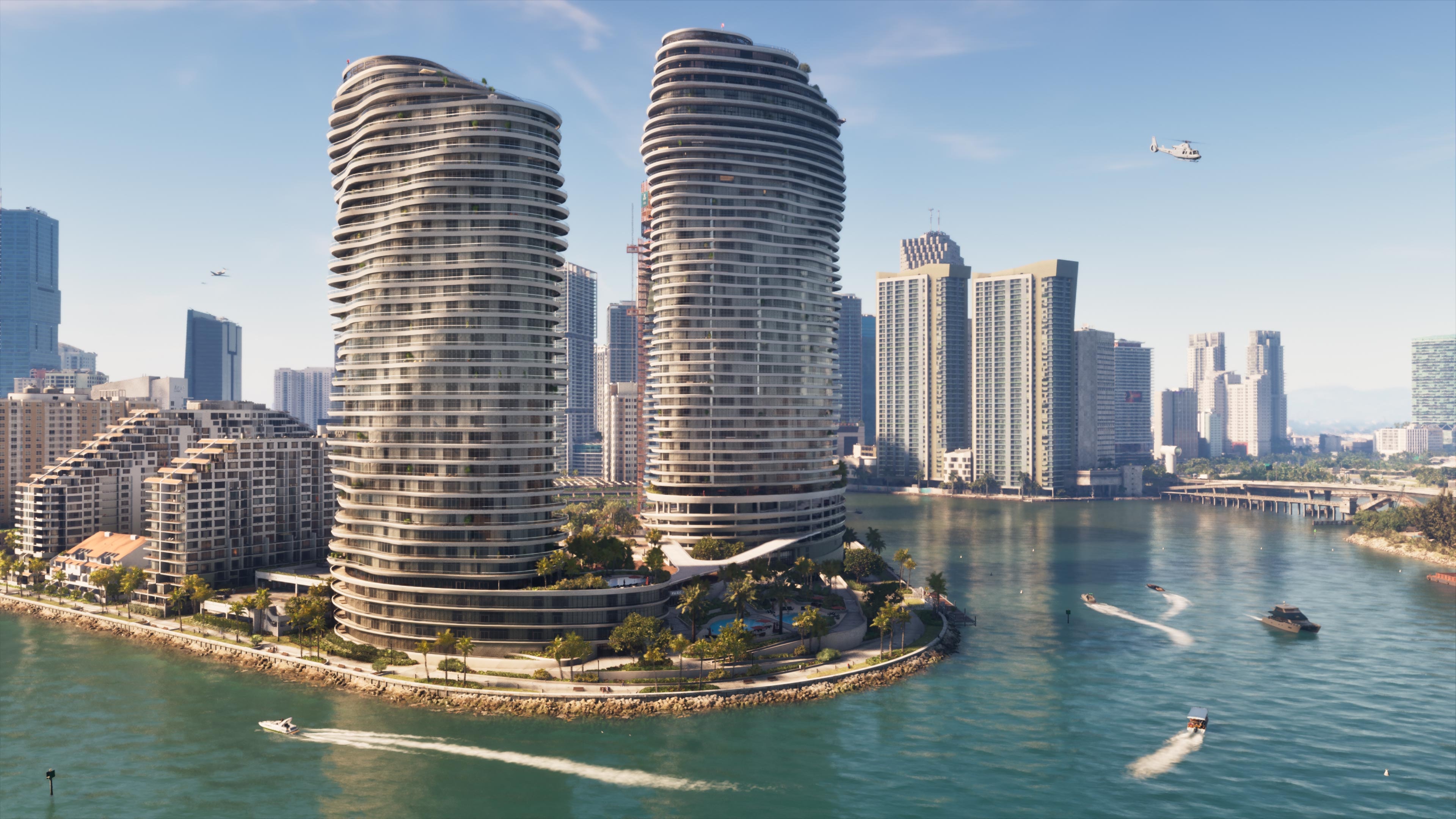 Two curved residential towers by the bay, with boats sailing and skyscrapers behind.