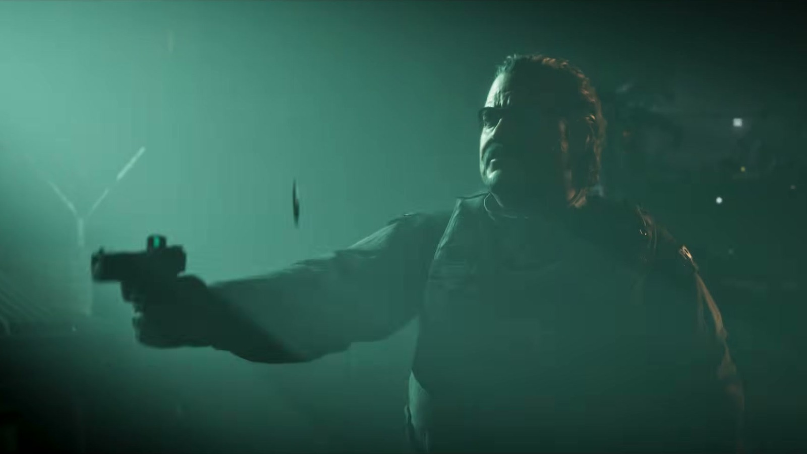 A man in sunglasses aims a red-dot pistol through green fog.